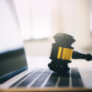 Gavel on laptop keyboard legal theme