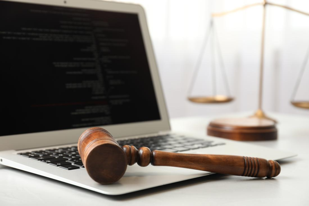 Laptop with code and law gavel